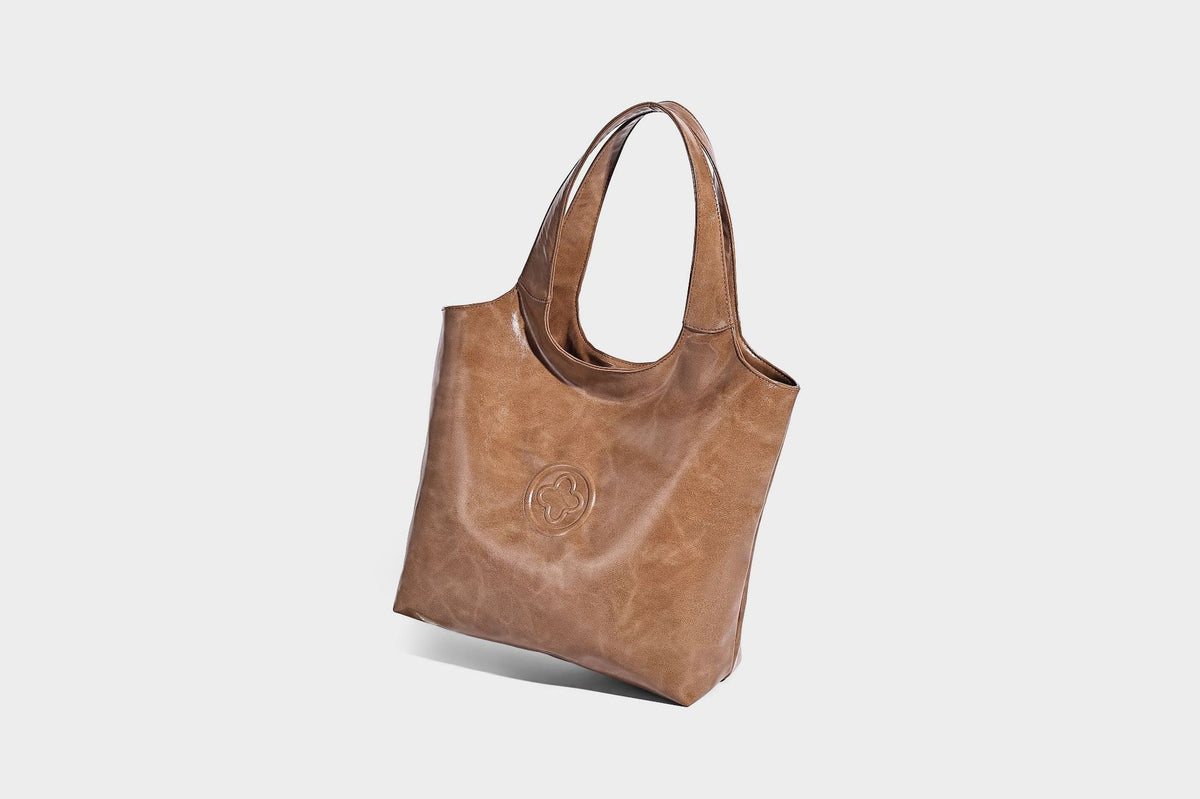 Glossy oil-wax leather-look open-top tote shoulder bag with embossed circular logo and long double straps, detail view 19