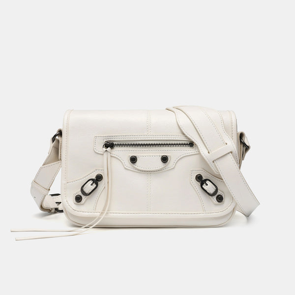 Small structured rectangular crossbody bag with crinkle leather-look finish, front zip pocket, gunmetal stud hardware, and