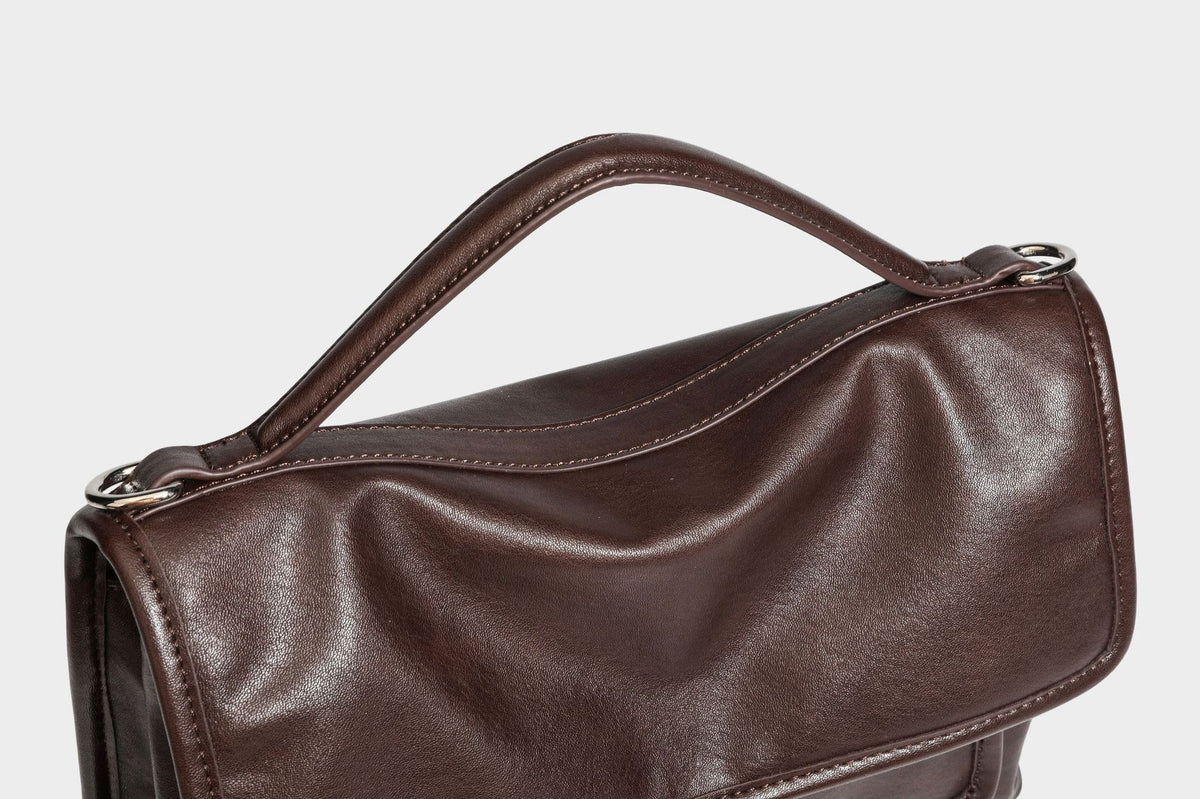 Structured rectangular satchel bag in dark espresso brown with smooth leather-look finish, flap front with silver turn-lock