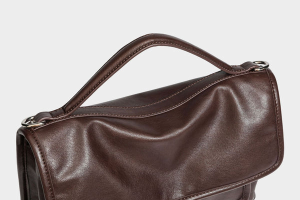 Structured rectangular satchel bag in dark espresso brown with smooth leather-look finish, flap front with silver turn-lock