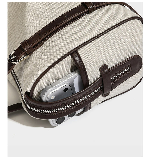 Cream canvas barrel shoulder bag with dark brown leather-look straps, trim, and silver-tone hardware, detail view 15