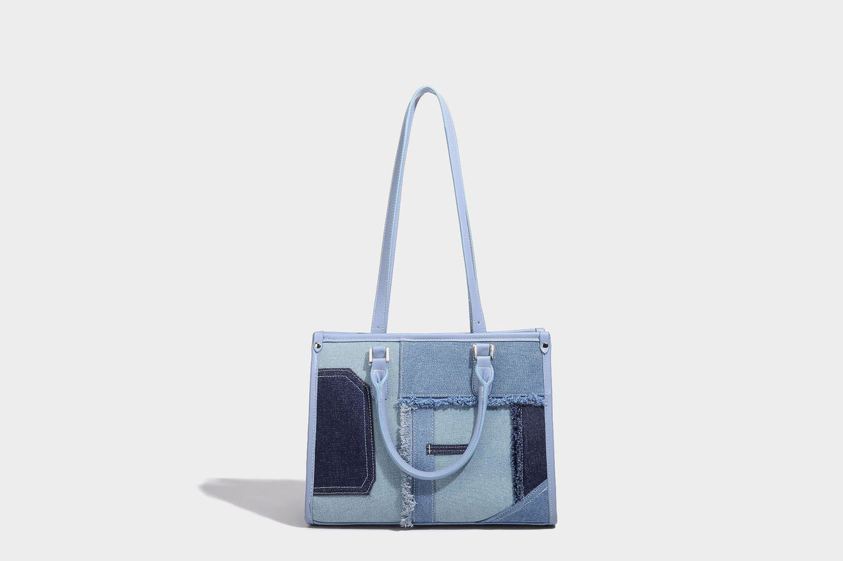 Structured patchwork denim tote bag with frayed panel seams, dual top handles, and silver-tone hardware, detail view 14