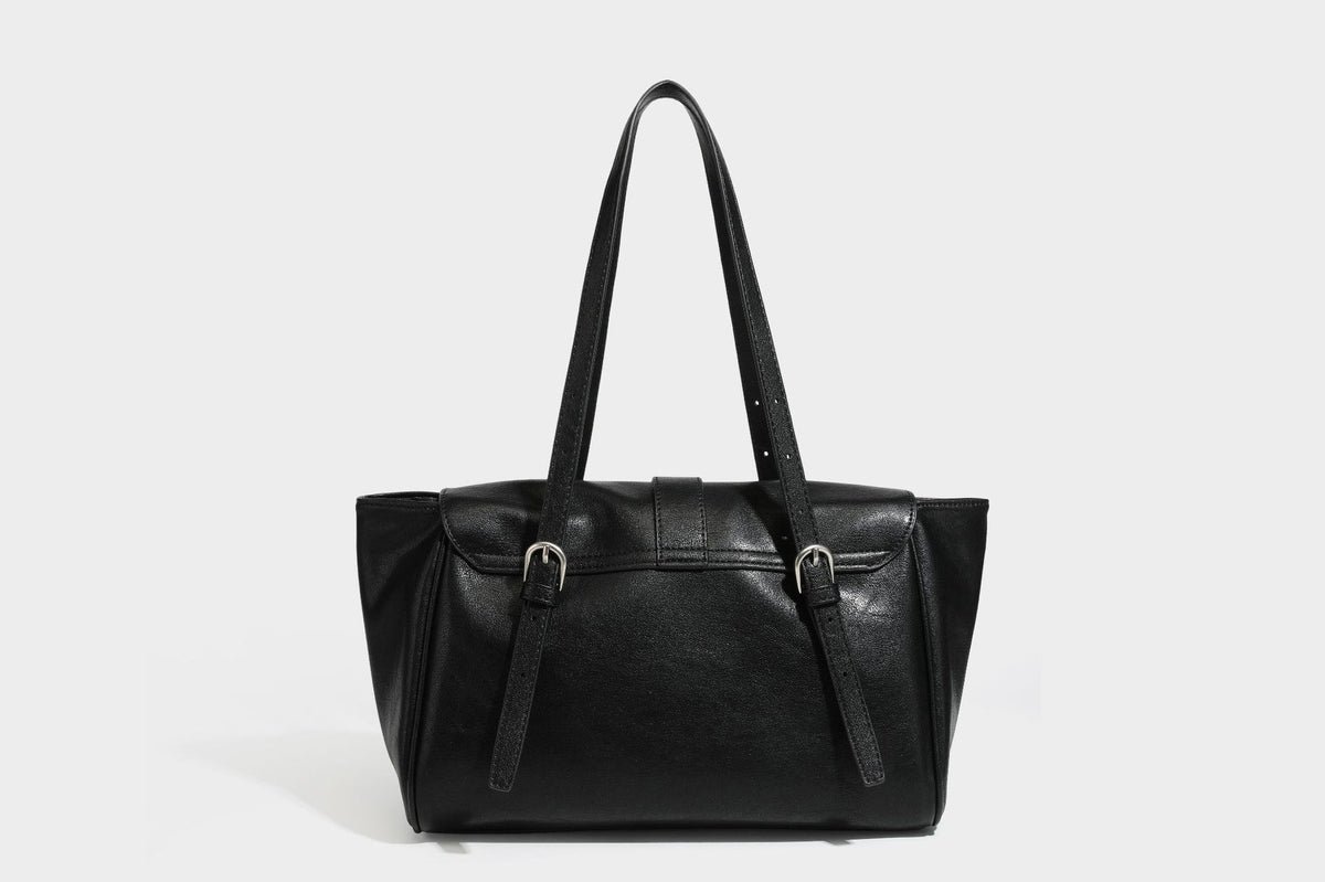 Large structured vintage-style tote bag with flap-front turn-lock closure, twin buckle straps, and double shoulder handles