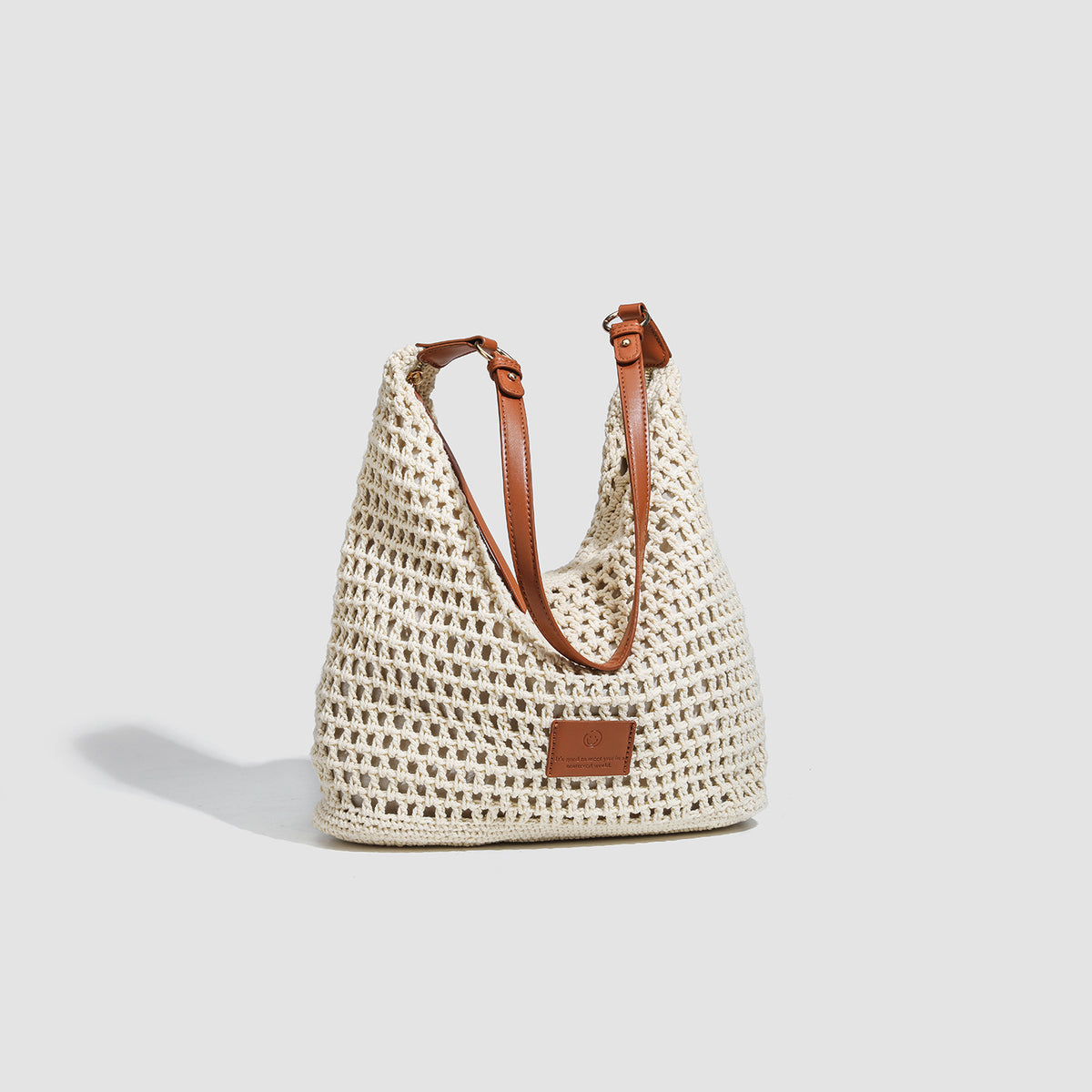 Cream open-weave crochet hobo shoulder bag with tan leather-look strap and gold-tone ring hardware, detail view 3