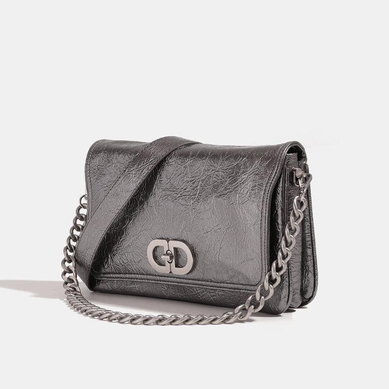 Rectangular flap shoulder bag with chunky silver-tone chain strap and crinkled leather-look finish, detail view 4
