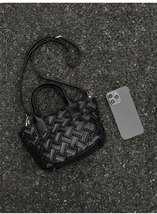 Small black glossy woven tote bag with dual top handles and detachable shoulder strap, detail view 12