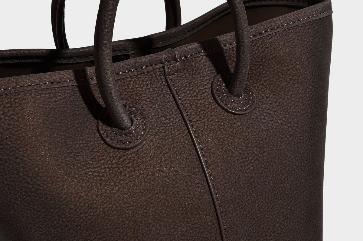 Small structured matte pebbled tote bag with twin top handles and removable zip pouch, detail view 21