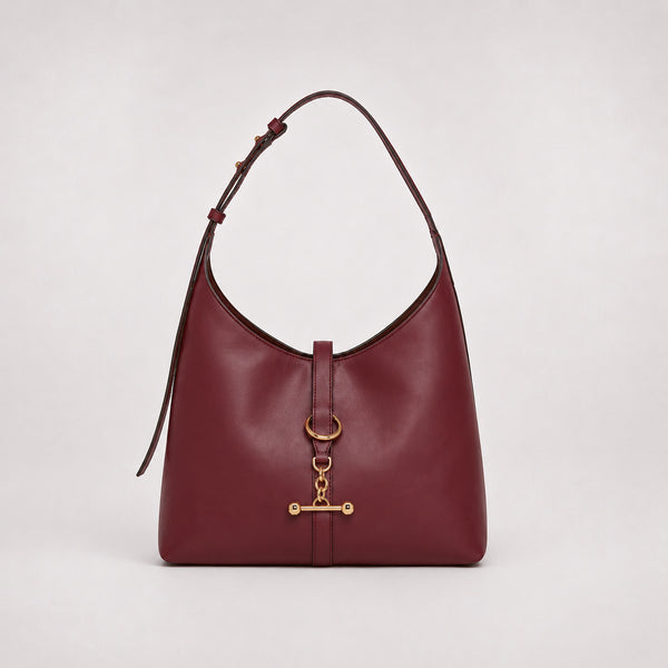 Slouchy hobo shoulder bag with gold-tone toggle ring hardware and adjustable strap, detail view 9
