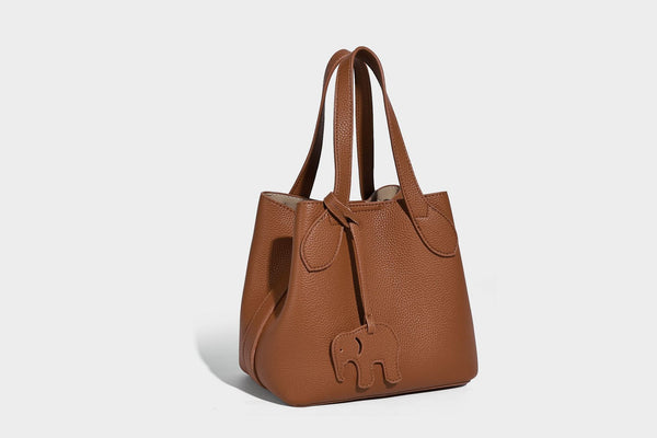 Compact pebbled bucket tote bag with elephant charm, twin top handles, and detachable crossbody strap, detail view 29