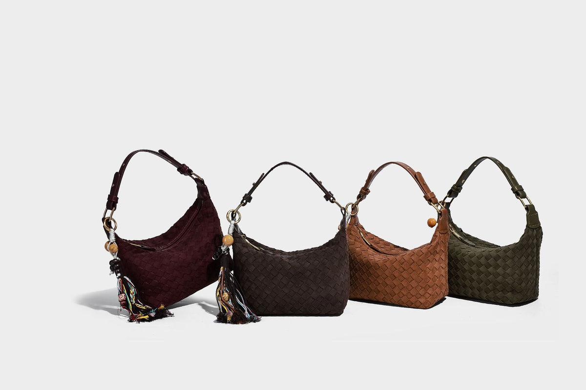 Small woven-texture crescent hobo bag in dark chocolate brown with top zip closure, gold-tone hardware, and adjustable