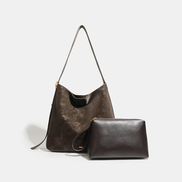 Large slouchy hobo tote bag in distressed dark brown leather-look finish with long shoulder strap, gold-tone ring hardware
