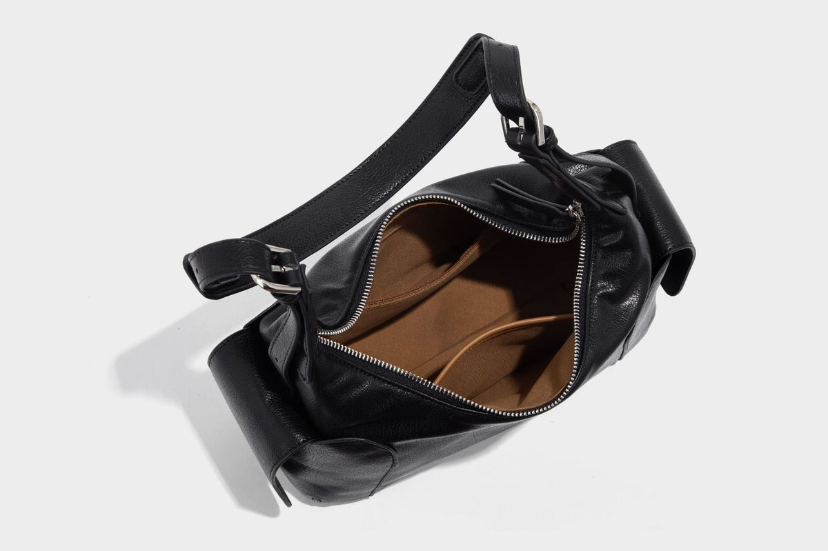 Soft pebbled leather-look hobo shoulder bag with zip top closure, side flap pockets, and silver-tone hardware, detail view 26