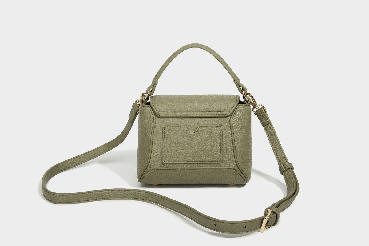 Small structured pebbled flap mini satchel with gold-tone bar hardware, short top handle, and detachable crossbody strap