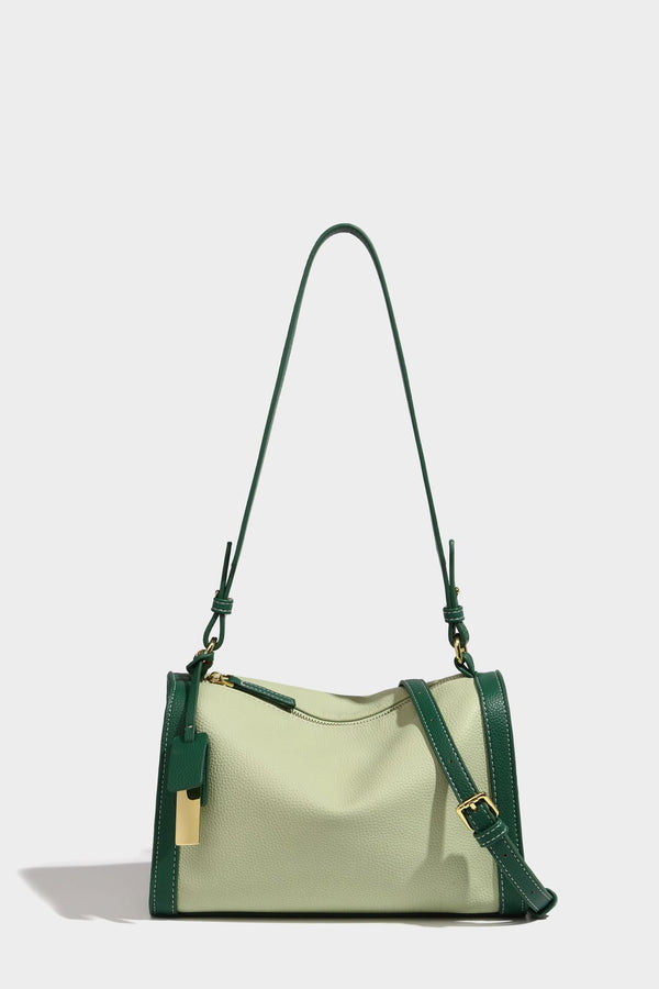 Structured two-tone shoulder bag with pebbled leather-look finish, contrast trim, top zip closure, and gold-tone hardware