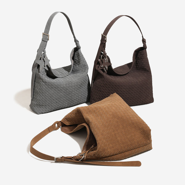 Slouchy woven hobo shoulder bag with matte suede-like finish, adjustable strap, and star charm hardware, detail view 2