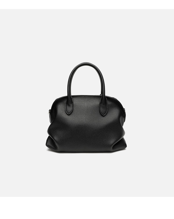 Rounded dome shell handbag in pebbled leather-look finish with twin top handles, zip closure, decorative horse charm, and