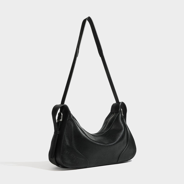 Slouchy crescent hobo shoulder bag in dark brown pebbled leather-look finish with zip top and long shoulder strap, front view