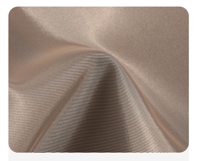 Large matte nylon backpack handbag with cognac leather-look trim, snap flap, and gold-tone hardware, detail view 10