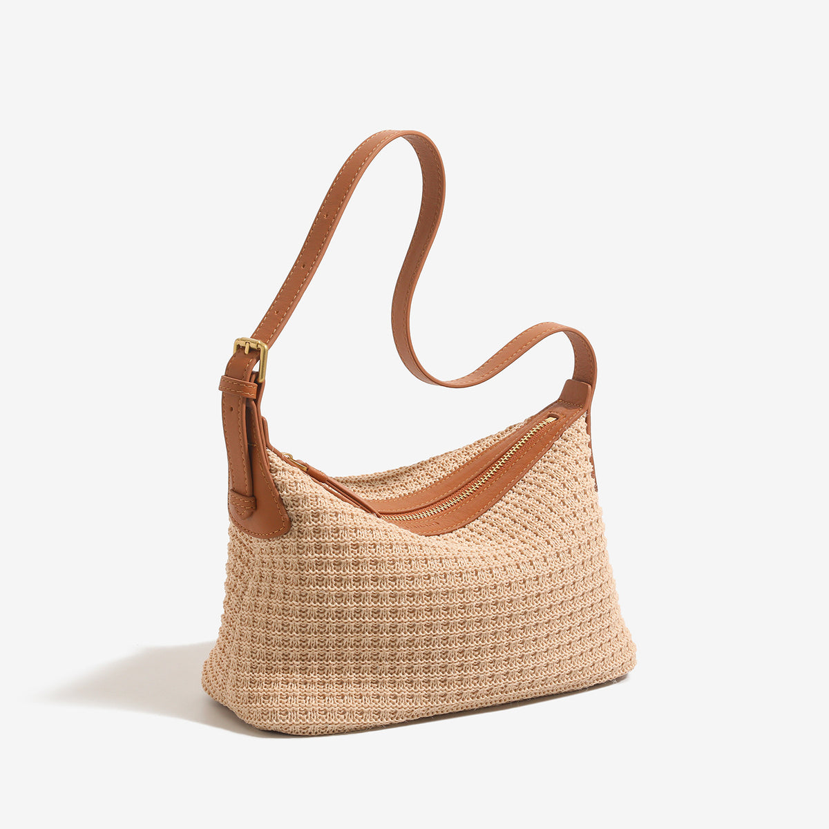 Beige woven raffia-style hobo shoulder bag with caramel leather-look trim, gold-tone zip closure, and adjustable strap