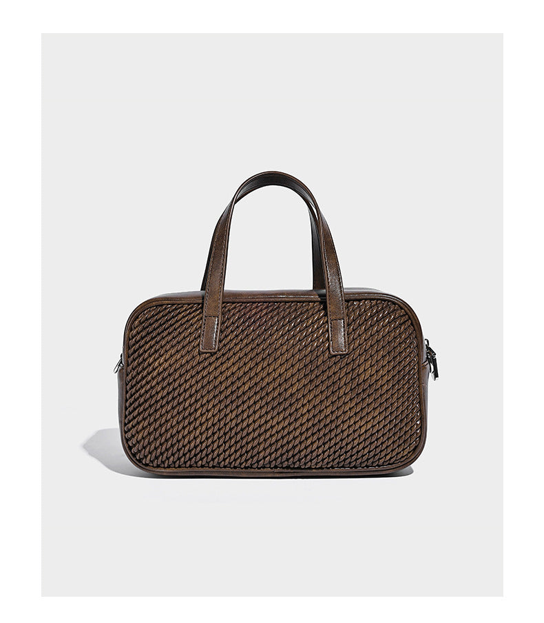 Structured woven-texture front top-handle handbag with zip closure, dual handles, detachable shoulder strap, and matching