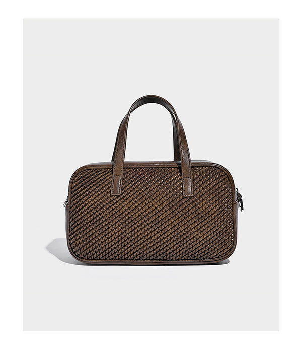 Structured woven-texture front top-handle handbag with zip closure, dual handles, detachable shoulder strap, and matching