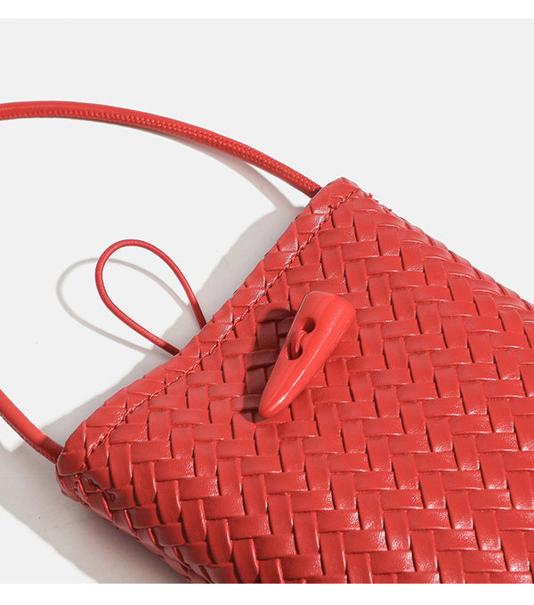 Compact woven leather-look bucket crossbody pouch with toggle closure and long fixed strap, detail view 14