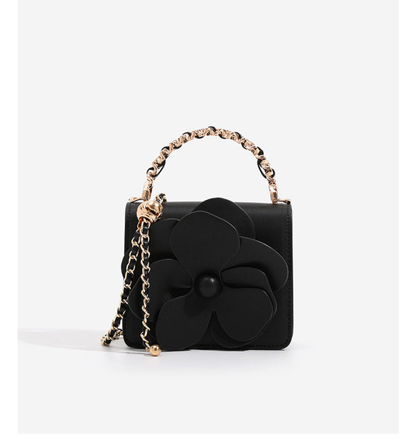 Small structured rectangular crossbody bag with layered 3D flower appliqué and gold-tone chain strap, detail view 11