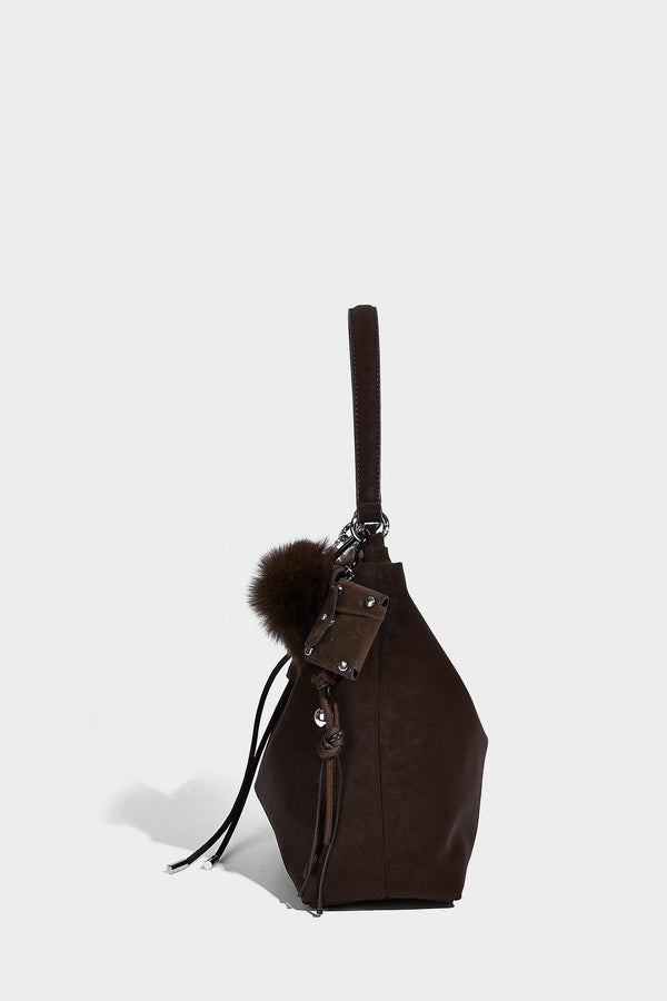 Slouchy matte-finish hobo shoulder bag with tassel cords, silver-tone hardware, and faux-fur pom charm, detail view 24