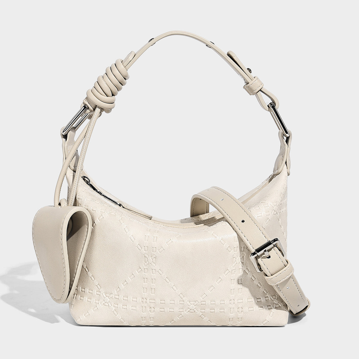 Small embossed half-moon shoulder bag with top zipper, detachable front pouch, and adjustable slim strap, detail view 6