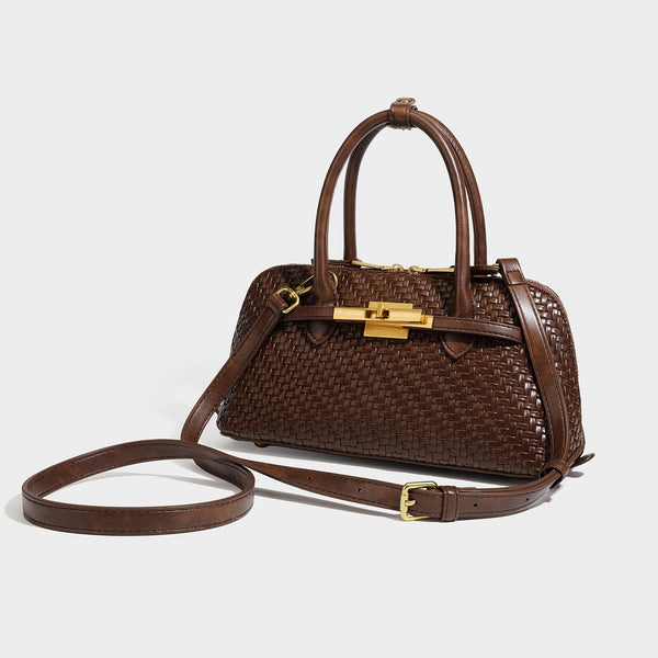 Structured woven-embossed leather-look satchel with dual rolled top handles, gold-tone turn-lock closure, and detachable