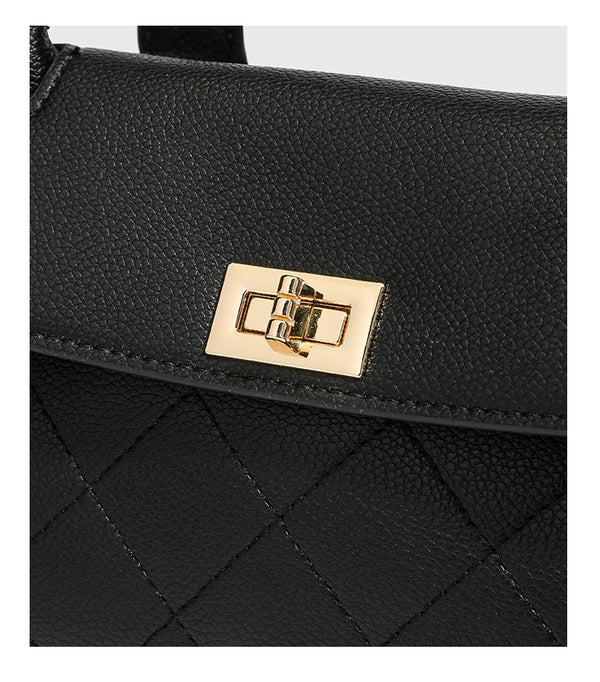 Structured black diamond-quilted shoulder bag with gold-tone turn-lock flap closure and dual round shoulder straps, detail