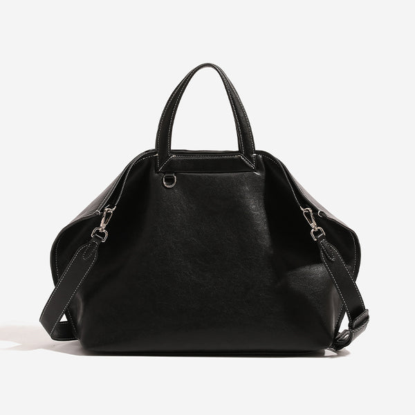 Structured cognac brown leather-look tote bag with fold-ear side panels, top handles, gold-tone hardware, and detachable