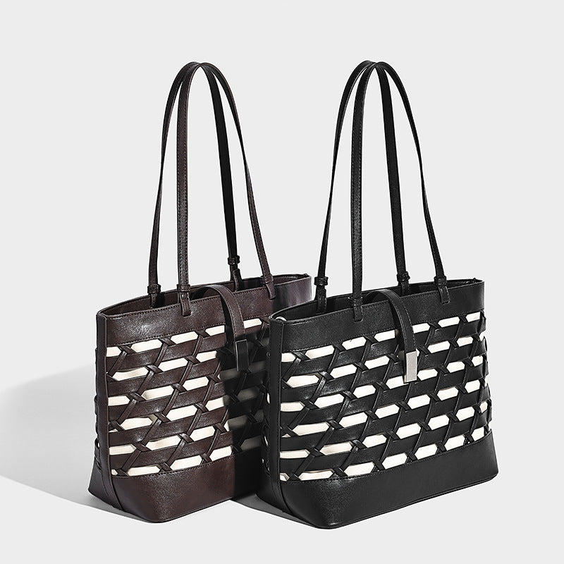 Structured woven lattice cutout tote bag with smooth leather-look trim, dual shoulder straps, and silver-tone hardware