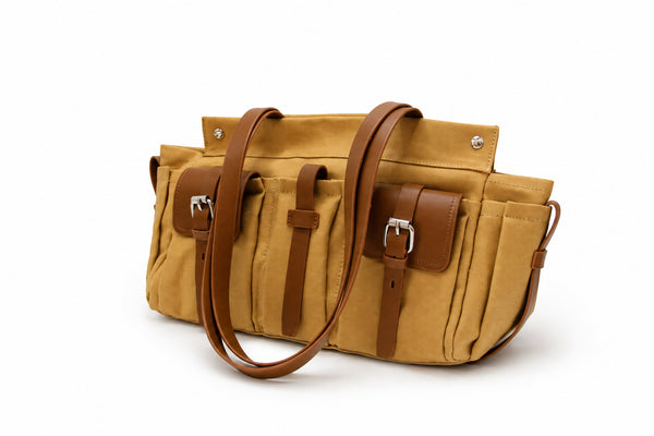Large olive canvas shoulder tote bag with multiple front buckle-strap pockets and dark brown leather-look trim, detail view 8