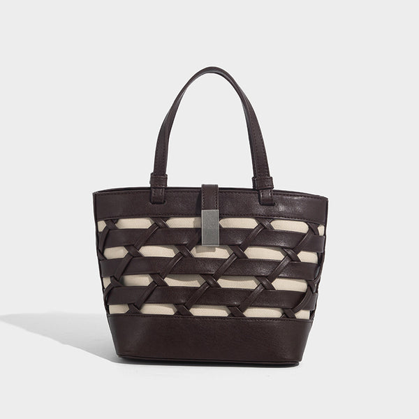 Structured woven lattice tote bag with cream lining, dual top handles, detachable crossbody strap, and silver-tone hardware