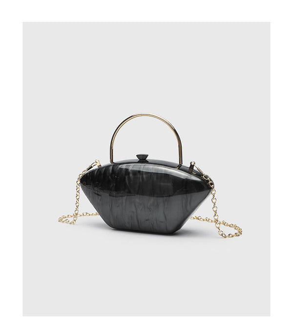 Shell-shaped pearlescent top-handle clutch bag with arched gold-tone metal handle and gold chain strap, detail view 14