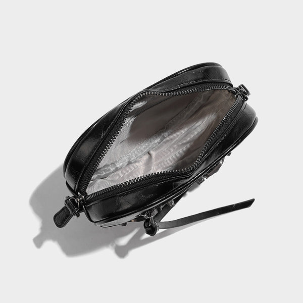 Mini heart-shaped crossbody bag with glossy crinkled finish and moto buckle hardware, detail view 26