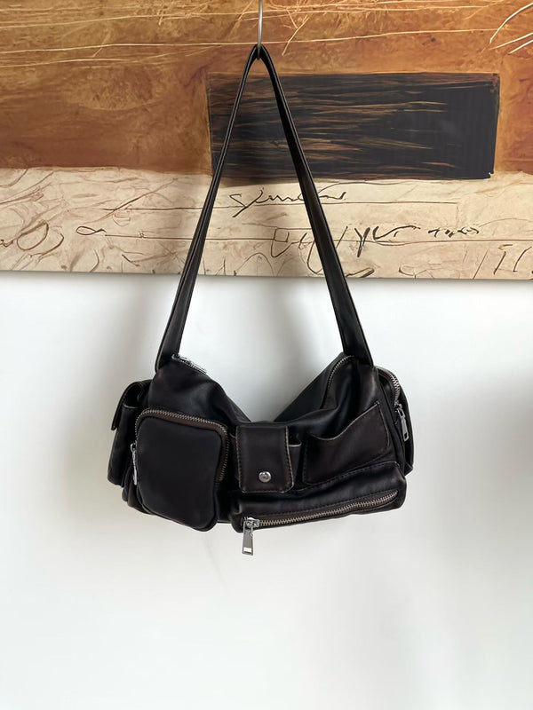 Slouchy multi-pocket leather-look shoulder bag with silver-tone hardware and adjustable strap, detail view 13