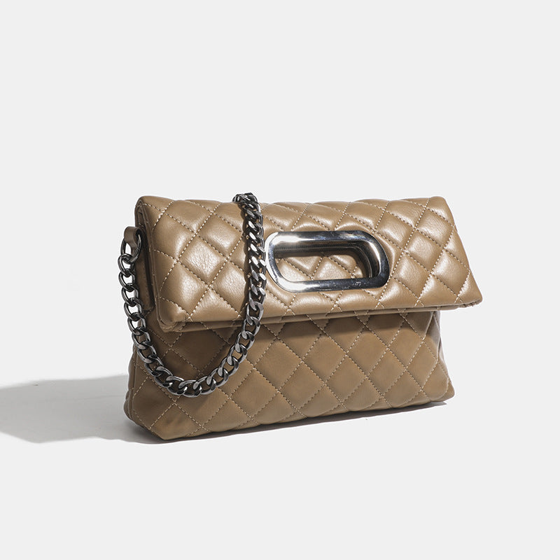 Quilted diamond-stitch flap crossbody bag with gunmetal chain strap and cut-out bar handle, detail view 8