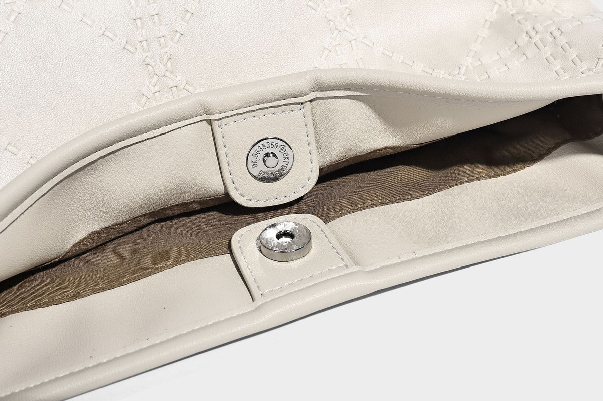 Diamond-quilted leather-look bucket shoulder bag with knotted strap accent and attached mini pouch, detail view 31