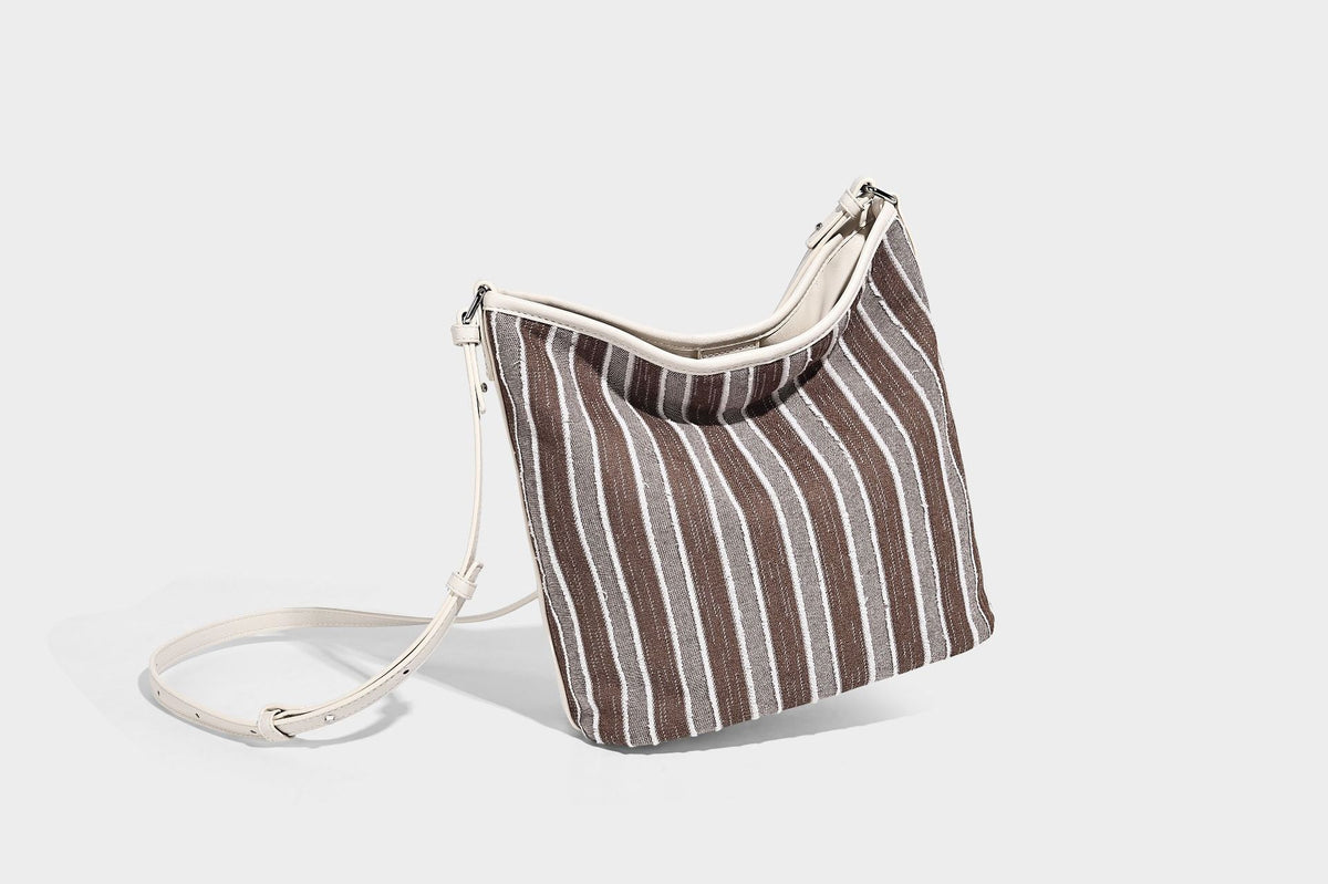 Large striped canvas hobo shoulder bag with cream trim and silver-tone hardware, detail view 23