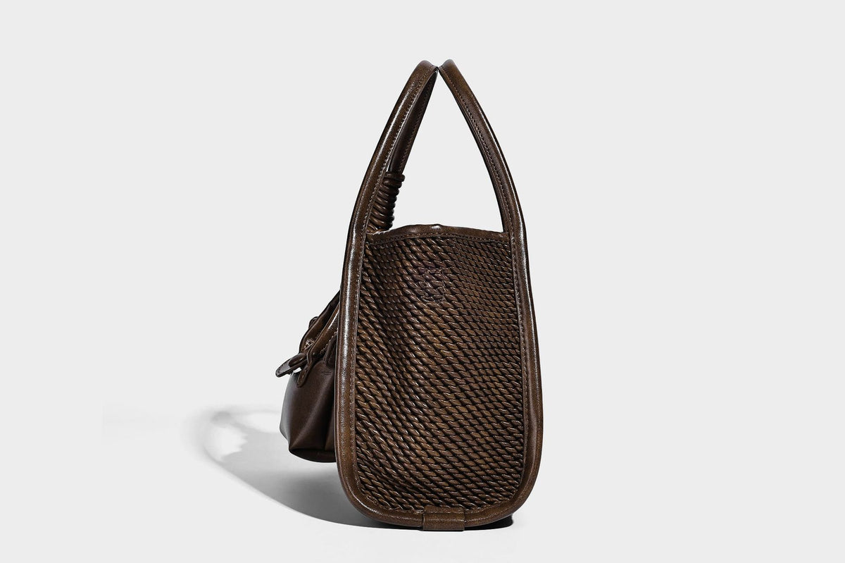 Large structured woven rope-texture tote bag with smooth leather-look trim, knotted dual top handles, detachable mini front