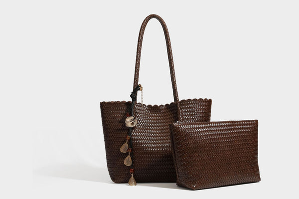 Large open-top woven leather-look tote bag in dark brown with scalloped edge, braided double shoulder straps, and decorative