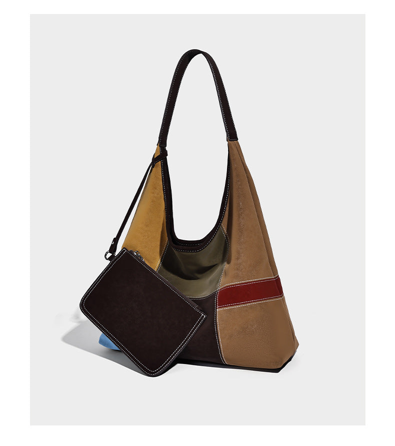 Multicolor patchwork hobo shoulder bag with brown tan olive mustard red and blue suede-look panels, contrast white stitching