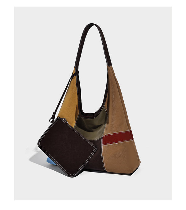 Multicolor patchwork hobo shoulder bag with brown tan olive mustard red and blue suede-look panels, contrast white stitching