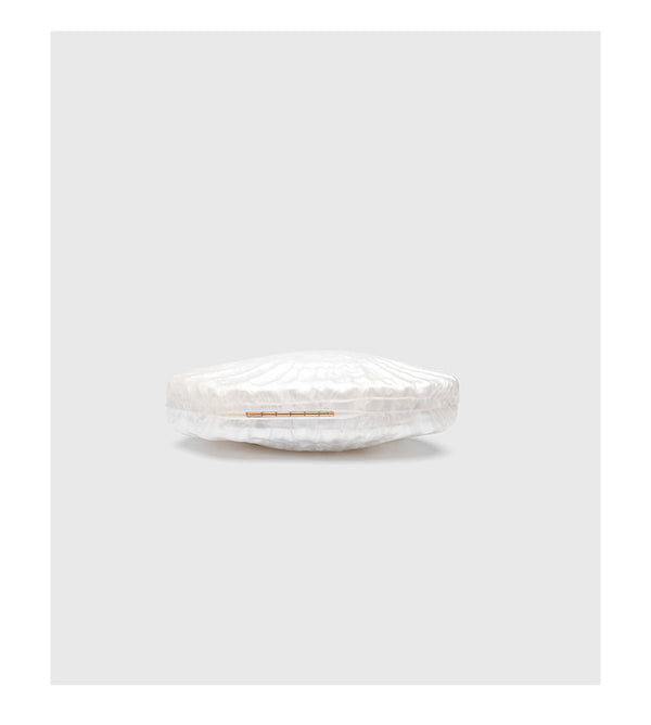 Oval pearl-finish shell clutch bag with gold-tone clasp and removable gold link chain strap, detail view 9