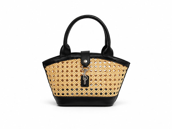 Structured mini tote bag with open-weave rattan body, leather-look arched handles and trim, front tab turn-lock closure, and