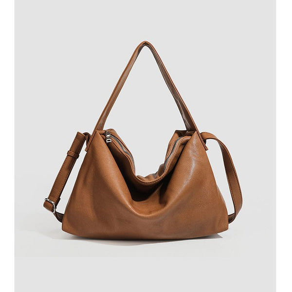 Slouchy leather-look hobo shoulder bag with top zipper and silver-tone hardware, detail view 3
