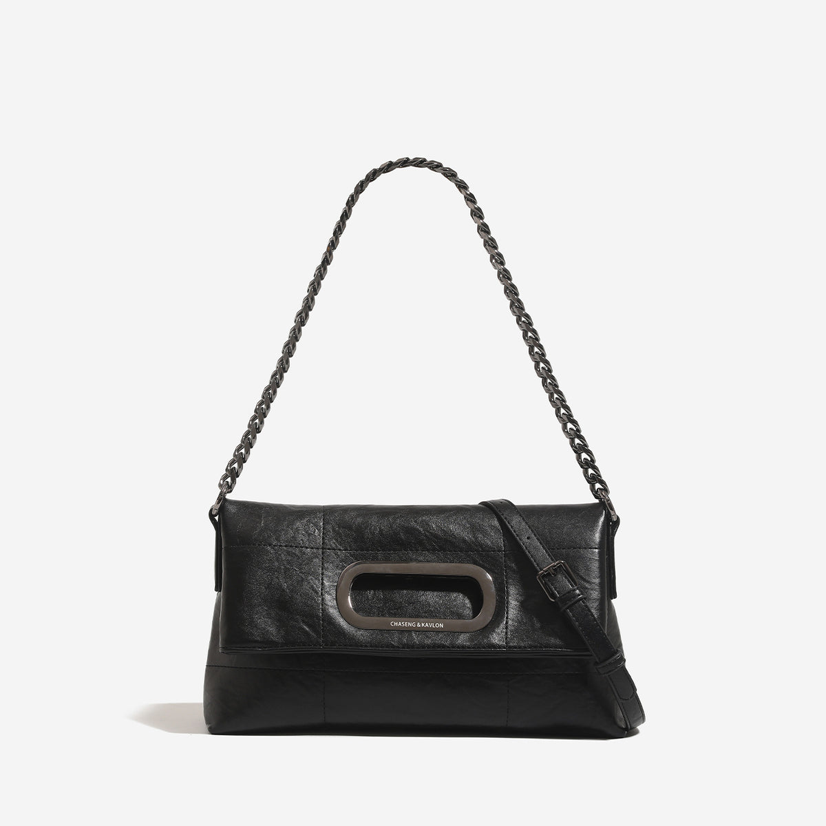 Soft rectangular leather-look convertible shoulder bag with dark curb-chain strap and rounded rectangular metal handle