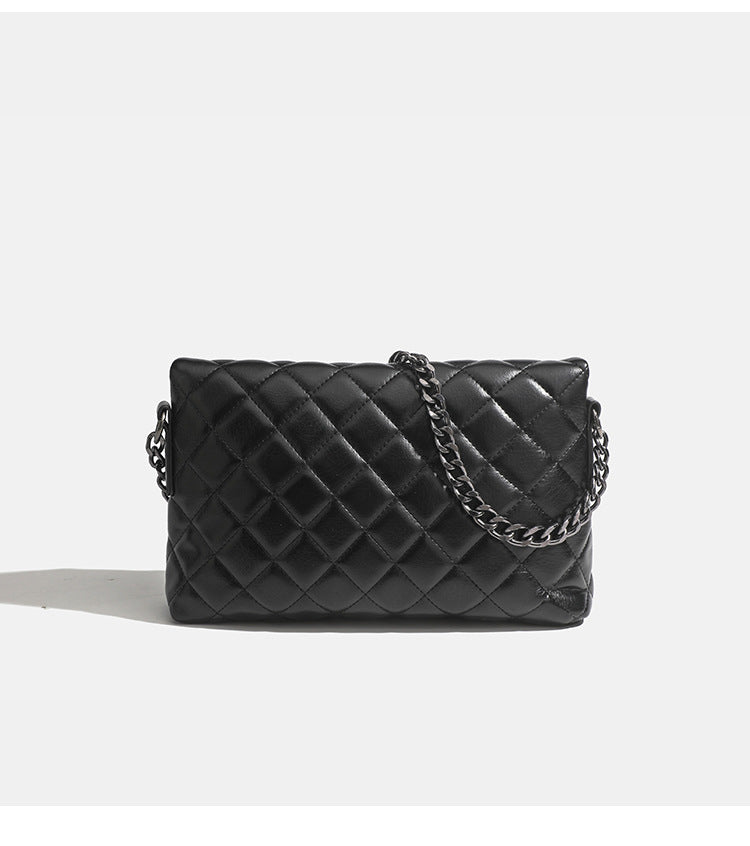 Quilted diamond-stitch flap crossbody bag with gunmetal chain strap and cut-out bar handle, detail view 11